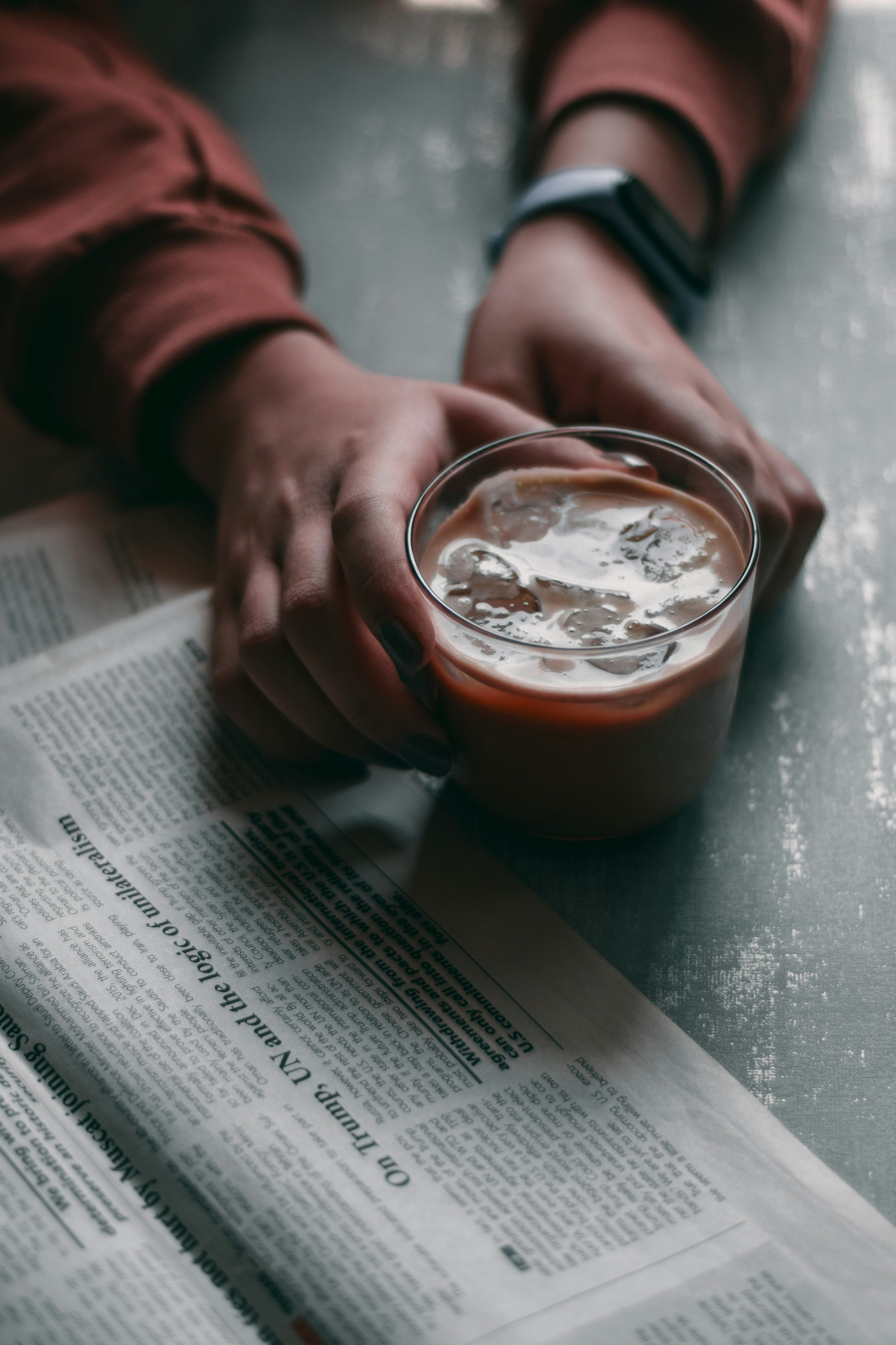 clear drinking glass with brown liquid